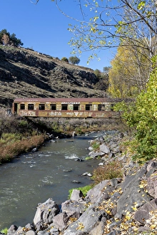 Crossing Prints: A train carriage used as a bridge to cross a river