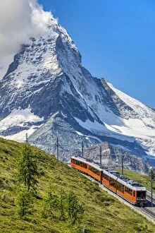 Images Dated 13th September 2021: Train along the Gornergrat mountain rack railway with Matterhorn in the foreground