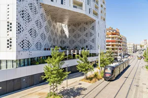 Trams Prints: Tram passing The Hotel Beloria, Montpellier, Herault, France