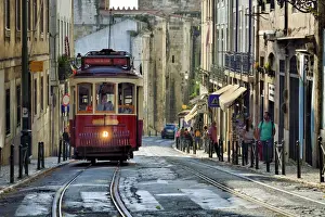 City Life Prints: A tramway in Alfama district with the Motherchurch (Se Catedral) in the background