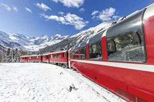 Railway Gallery: Transit of Bernina Express train at Montebello curve with view on Morterasch glacier