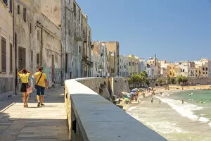 Sicilia Gallery: Trapani, Sicily. Seascape of the town with people walking on the baroque street