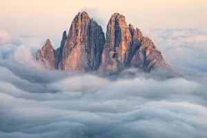 Tre Cime di Lavaredo emerging from the clouds, Sexten Dolomites, South Tyrol, Bolzano