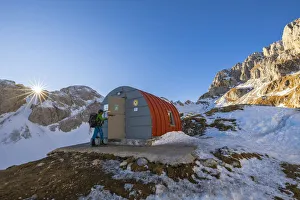 Trekker Prints: A trekker enters the CittÔêÜÔÇá di Clusone Bivouac
