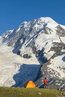 A trekker is looking the Lyskamm, one of the peaks of the Monte Rosa Massif close to