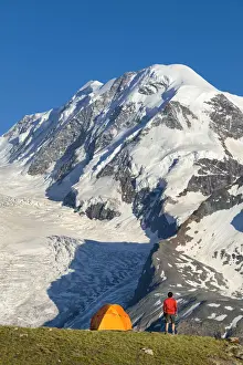 Highest Prints: A trekker is looking the Lyskamm, one of the peaks of the Monte Rosa Massif close to