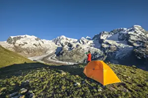 High Prints: A trekker is in front of the Swiss side of Monte Rosa Massif close to Riffelsee Lake