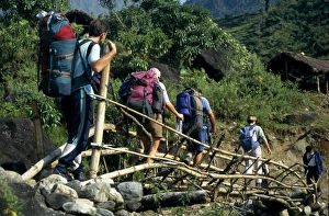 Adventuresome Gallery: Trekkers crossing temporary bridge