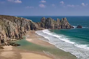 Logan Rock Prints: Treryn Dinas and Logan Rock across the beautiful sandy beach at Pedn Vounder, Cornwall