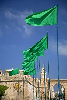 Drama Prints: Tripoli, Libya; Libyan flags prominently displayed on Green Square in front of the entrance to the old Medina
