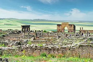 Clear Sky Prints: Triumphal Arch of Caracalla at Volubilis and old roman ruins, Volubilis, Meknes, Morocco