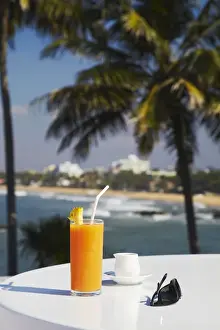 Sunglasses Prints: Tropical fruit juice on outdoor terrace table at Mount Lavinia Hotel, Mount Lavinia