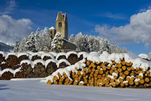 Images Dated 10th April 2015: Trunks and old church in Celerina with pristine snow. Engadine, Switzerland, Europe