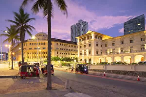 Tuk tuks parked outside Galle Face Hotel at sunset, Colombo, Sri Lanka