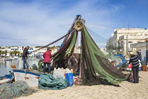Tunisia, Bizerte, The Old Port, Fishermen examining nets