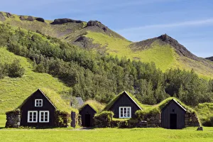 Images Dated 23rd February 2022: Turf roofed houses under mountain range at Skogar Museum, Skogar, Rangarping eystra