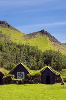 Images Dated 23rd February 2022: Turf roofed houses under mountain range at Skogar Museum, Skogar, Rangarping eystra