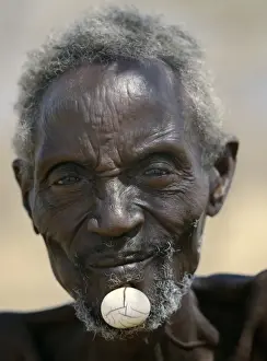 Head Dress Prints: Turkana elders wear decorative ivory lip ornaments