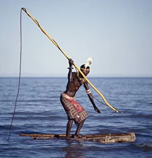 Tribal Attire Collection: The Turkana spear-fish in the shallow waters of Lake Turkana