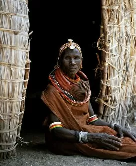 Tribal Jewellery Collection: A Turkana woman sitting in the doorway of her hut