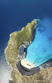 Turquoise lagoon surrounding the famous Shipwreck Beach (Navagio Beach) from above, aerial view, Zakynthos island, Greece