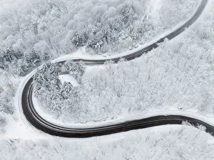 Lane Prints: Twisting road in winter, Schuss Pass, Waitsfield, Vermont, USA