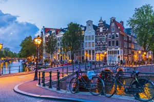 Bicylces Gallery: Typical buildings in Amsterdam at dusk, Holland / Netherlands