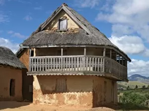 A typical double-storied Malagasy highland house with a carved balcony