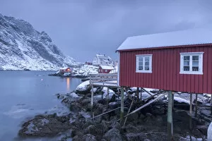 Images Dated 26th February 2016: Typical fishermen houses called rorbu in the snowy landscape at dusk Nusfjord Nordland