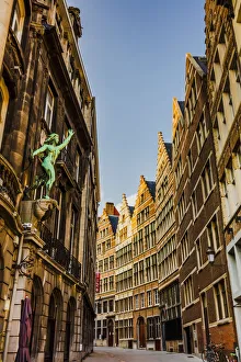 Images Dated 25th November 2019: Typical road in Antwerp with old buildings and a statue, Belgium