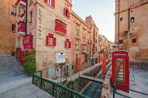 Street Scene Prints: Typical Street Scene in the heart of Valletta, Red British Telphone Box, Valletta, Malta