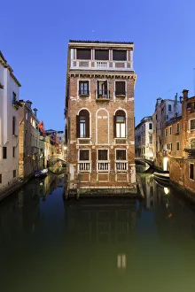 Typical Venetian canals at dusk. Venice, Veneto, Italy