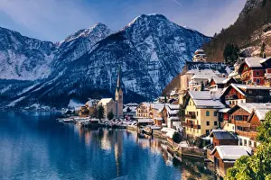 Typical village called Hallstatt con the Hallstatter see at sunrise with the houses