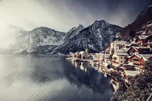 Typical village called Hallstatt con the Hallstatter see at sunrise with the houses