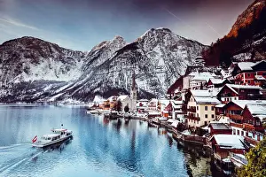 Typical village called Hallstatt con the Hallstatter see at sunrise with the houses