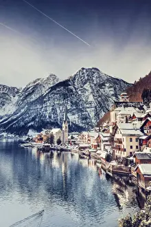 Typical village called Hallstatt con the Hallstatter see at sunrise with the houses
