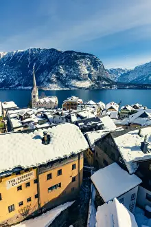 Typical village called Hallstatt con the Hallstatter see at sunrise with the houses