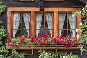 Typical wooden house decorated with flowers, Zermatt, Valais, Switzerland