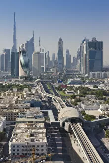Images Dated 31st May 2016: UAE, Dubai, Downtown Dubai skyline above metro rail
