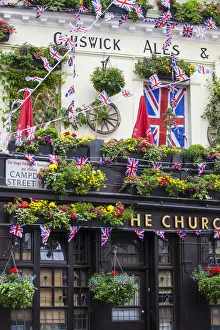 UK, England, London, Kensington, The Churchill Arms Pub with Union Jack bunting to