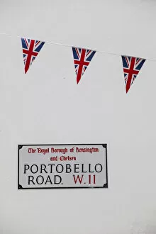 Images Dated 30th August 2012: UK, England, London, Kensington, Union Jack bunting above Portobello Rd sign to celebrate