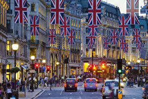 Images Dated 8th March 2012: UK, England, London, Regent Street, Taxis and Union Jack Flags