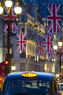 Images Dated 8th March 2012: UK, England, London, Regent Street, Taxis and Union Jack Flags