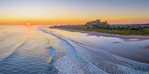 Northumberland Prints: UK, England, Northumberland, Bamburgh, Bamburgh Beach, Bamburgh Castle at sunrise