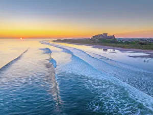 Northumbria Prints: UK, England, Northumberland, Bamburgh, Bamburgh Beach, Bamburgh Castle at sunrise