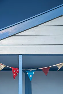 Eastern England Prints: UK, England, Suffolk, Southwold, Promenade, Bunting decorating a Beach Hut