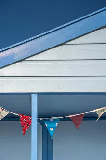UK, England, Suffolk, Southwold, Promenade, Bunting decorating a Beach Hut