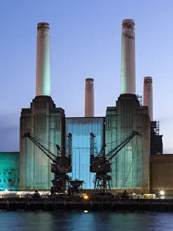 Urban Scene Prints: UK, London, Battersea power station illuminated by colored light at dusk