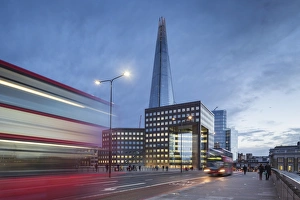 Blurred Motion Gallery: UK, London A view of The Shard from London Bridge at dusk with a tipycal London Double