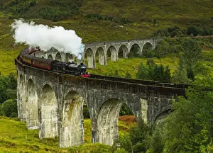 UK, Scotland, Highlands, Jacobite Steam Train crossing the Glenfinnan Viaduct